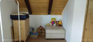 a childs bedroom with a bunk bed and toys at Kuća za odmor Denis in Mala Lešnica