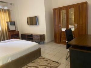 Rúm í herbergi á Hôtel rotana