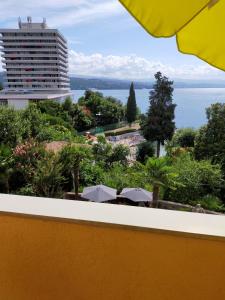 a view of the ocean from the balcony of a hotel at Apartments Ivna Bilek in Opatija