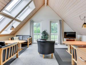 a living room with skylights in a attic at Holiday Home Ursula - 100m to the inlet in SE Jutland by Interhome in Gråsten