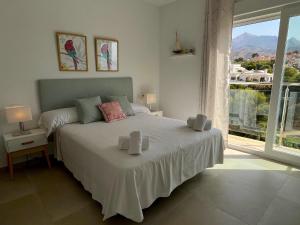 Posteľ alebo postele v izbe v ubytovaní Nerja Paradise Rentals - Villa Encanto