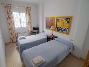 Postel nebo postele na pokoji v ubytování Nerja Paradise Rentals - Villa Las Brisas