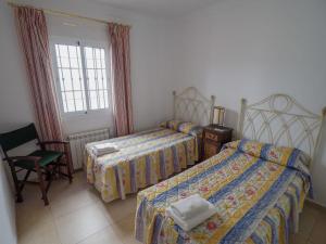 Posteľ alebo postele v izbe v ubytovaní Nerja Paradise Rentals - Villa Las Brisas + 26 fotografií