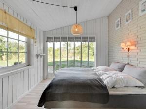 Postel nebo postele na pokoji v ubytování Holiday Home Valdemar - 350m to the inlet in Western Jutland by Interhome