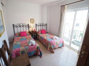 Postel nebo postele na pokoji v ubytování Nerja Paradise Rentals - Villa Las Palomas