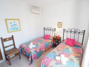 Postel nebo postele na pokoji v ubytování Nerja Paradise Rentals - Villa Las Palomas