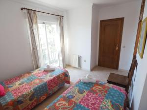 Postel nebo postele na pokoji v ubytování Nerja Paradise Rentals - Villa Las Palomas
