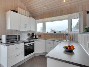 Kuchyň nebo kuchyňský kout v ubytování Holiday Home Nine - 200m from the sea in SE Jutland by Interhome