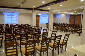 a room with rows of chairs in a lecture hall at Hotel Czerniewski in Warsaw