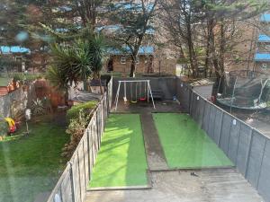 an aerial view of a backyard with a playground at Modern Executive 2-Bed Apartment in London in London