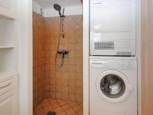 a washing machine in a bathroom with a shower at Holiday Home Aliza - 300m to the inlet in The Liim Fiord by Interhome in Roslev