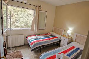 Posteľ alebo postele v izbe v ubytovaní Bal-30E - traditionally furnished detached villa with peaceful surroundings in Benissa