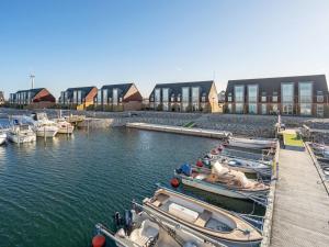 um grupo de barcos estão ancorados numa marina em Apartment Line - 10m from the sea in Djursland and Mols by Interhome em Glesborg
