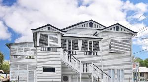 a large white building with stairs on the side of it at MJ's 2 bedroom luxury style apartment in Ipswich