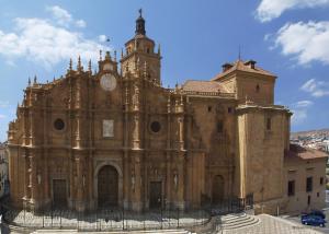 an old building with a clock tower on top of it at Hotel Mulhacen in Guadix
