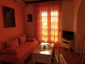 a living room with a couch and a table at Apartments Ivna Bilek in Opatija