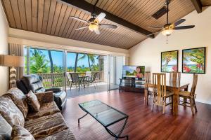 a living room with a couch and a table at Keauhou Resort 113 in Kailua-Kona