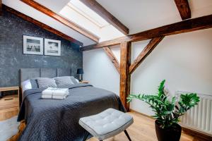 Posteľ alebo postele v izbe v ubytovaní VIP Apartamenty