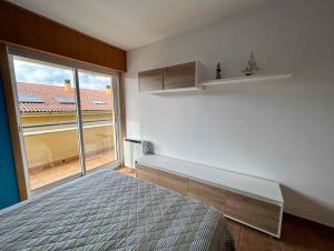 Postel nebo postele na pokoji v ubytování Apartamento Portosin con piscina al lado de la playa