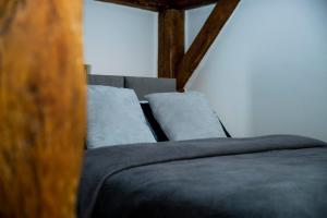 Posteľ alebo postele v izbe v ubytovaní VIP Apartamenty