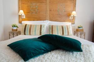 Ein Bett oder Betten in einem Zimmer der Unterkunft Dimora Dell'Erbe Rooms