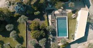 an overhead view of a yard with a swimming pool at Pedra Nova in Castelo Novo