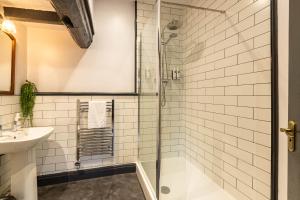 a bathroom with a shower and a sink at Royal Oak in Cartmel