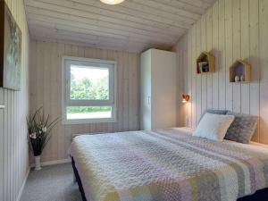 Postel nebo postele na pokoji v ubytování Holiday Home Ilina - 400m from the sea in NE Jutland by Interhome