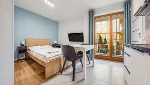 TV a/nebo společenská místnost v ubytování Apartamenty Sun & Snow Międzyzdroje Promenada