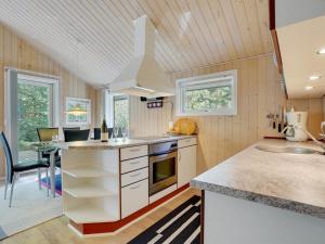 a kitchen with a sink and a counter top at Holiday Home Jussi - 3-5km from the sea in NW Jutland by Interhome in Brovst