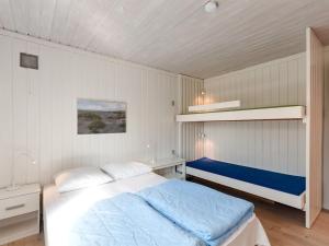 Postel nebo postele na pokoji v ubytování Apartment Ara - 700m from the sea in NW Jutland by Interhome