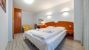 Posteľ alebo postele v izbe v ubytovaní Apartamenty Sun & Snow w Rezydencji Bielik