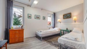 Posteľ alebo postele v izbe v ubytovaní Apartamenty Sun & Snow w Rezydencji Bielik