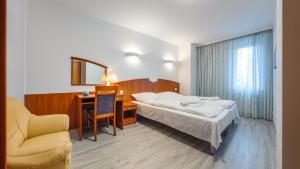 Posteľ alebo postele v izbe v ubytovaní Apartamenty Sun & Snow w Rezydencji Bielik