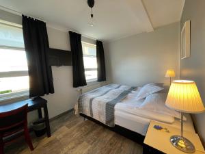 Ein Bett oder Betten in einem Zimmer der Unterkunft Akkeri Guesthouse