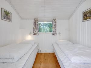 Postel nebo postele na pokoji v ubytování Holiday Home Kristiina - all inclusive - 300m from the sea by Interhome