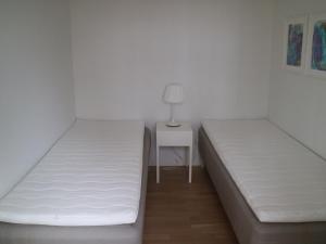 Postel nebo postele na pokoji v ubytování Apartment Tryggi - 350m from the sea in NE Jutland by Interhome