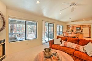 a living room with a couch and a table at Near Hiking and Golfing Pinetop Home with Deck! in Indian Pine +23 photos