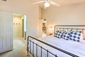 a bedroom with a bed and a ceiling fan at Near Hiking and Golfing Pinetop Home with Deck! in Indian Pine