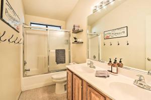 a bathroom with a shower and a sink and a toilet at Near Hiking and Golfing Pinetop Home with Deck! in Indian Pine