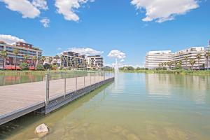 a bridge over a river with buildings in the background at Superbe Appt Port Marianne, Parking Privé, 4 personnes in Montpellier