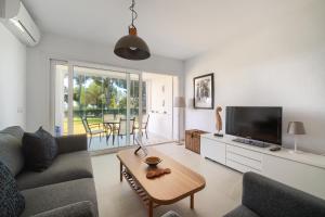 A television and/or entertainment centre at 31 Miraflores Jardin B, gorgeous views, pool, Wifi