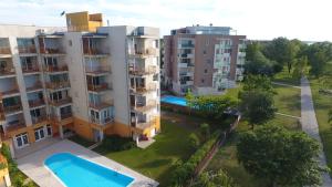 an overhead view of an apartment complex with a swimming pool at Viktória Beach Apartman Gold 2. Siófok in Siófok
