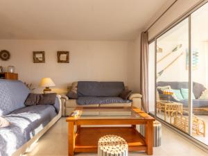 a living room with a couch and a coffee table at Apartment Rits-4 by Interhome in Salou