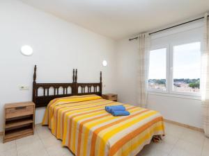 A bed or beds in a room at Apartment Policar by Interhome