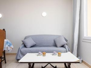 A seating area at Apartment Policar by Interhome