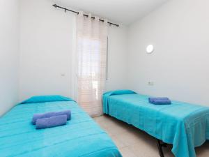A bed or beds in a room at Apartment Policar by Interhome