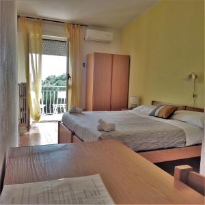Postel nebo postele na pokoji v ubytování Piccolo Hotel Nuova gestione