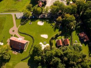 an overhead view of a park with a house and trees at Holiday Home Het Landhuis by Interhome in Losser