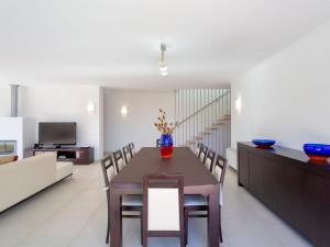 a kitchen and dining room with a table and chairs at Villa Almond Tree by Interhome in Porches +26 photos